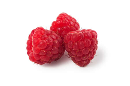 three raspberries on white background. close up.の写真素材