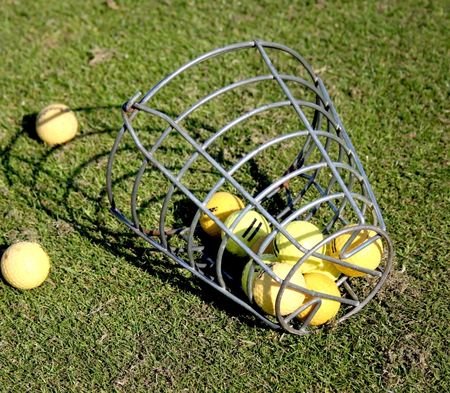 A bucket of practice range golf ballsの写真素材