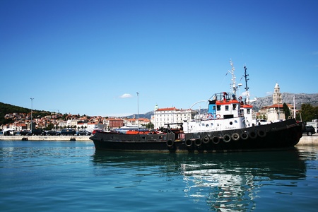 Working tug boat in port of Makarska city, Croatia の写真素材
