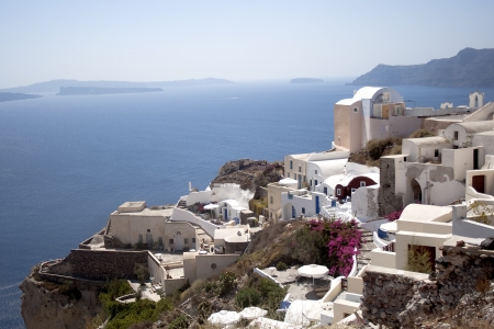 Small wonderful white houses located on the volcanic mountains of Santorini, Oia, Greeceの写真素材