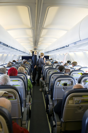 17th MARCH  RIGA, LATVIJA  Interior of passenger airplane with the seats prepares to flight Interior of passenger airplane with the seats  May be use for traveling cards and postersのeditorial素材