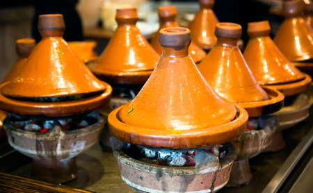  Moroccan ceramic tajines standing on burning hot coals