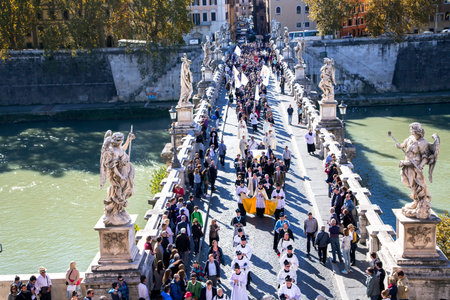 ITALY ROME OCTOBER 25 2014: Festive procession of priests on a Saint Angelo Bridge across the river...