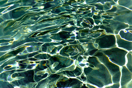 Fresh water in swimming-pool with rays of light