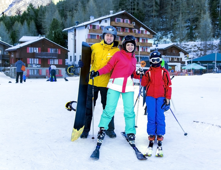SWITZERLAND, SAAS-FEE, DECEMBER, 26, 2015 - Young active family enjoys winter sports in the charming Swiss resort of Saas-Fee, Switzerlandのeditorial素材