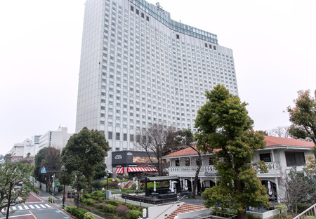 JAPAN, TOKYO, APRIL, 08, 2017 - Multi-storey modern building Shinagawa Goos hotel surrounded by a beautiful garden in Tokyo, Japanのeditorial素材