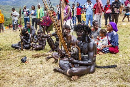 INDONESIA, PAPUA NEW GUINEA, WAMENA, IRIAN JAYA, AUGUST 20, 2019: Papuas tribe members on Baliem Valley festival in Wamena, New Guinea. The festival usually attended by hundreds of peoples local tribesのeditorial素材