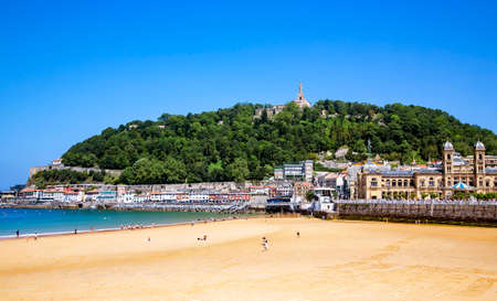 SPAIN, SAN SEBASTIAN, MAY, 12, 2018 - La Concha beach with view on of the Mount Urgul - on top of it stands the medieval fortress of La Mota and a statue of Christ. San Sebastian, Donostia, Spainのeditorial素材