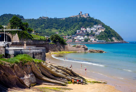 SPAIN, SAN SEBASTIAN, MAY, 10, 2018 - People enjoying playa de La Concha beach after the low tide of the Atlantic Ocean, San Sebastian, Donostia, Spainのeditorial素材