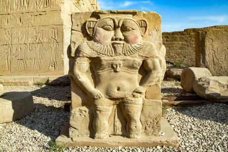 Relief sculpture block standing outside the Temple of Dendera or the Temple of Hathor. Egypt,...