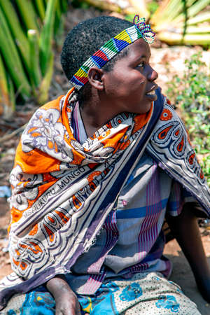 AFRICA, TANZANIA, MAY, 10, 2016 - Portrait young woman with bead decoration of the Hadzabe tribe. Hadzabe tribe threatened by extinction in Tanzania, Africaのeditorial素材