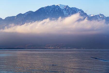 Beautiful view by a misty morning at sunrise on Lake Geneva in Montreux, Switzerlandの写真素材