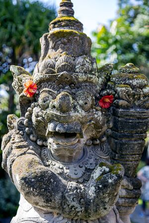 Various statues local deities in a beautiful garden in Bali, Indonesia.の写真素材