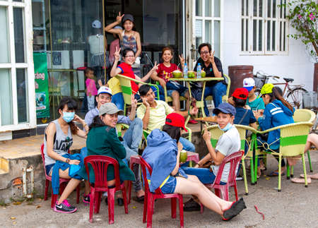 ASIA, VIETNAM, PHAN THIET, NOVEMBER, 15, 2014 - A large company of Vietnamese youth in cafe, Phan Thiet, Vietnamのeditorial素材