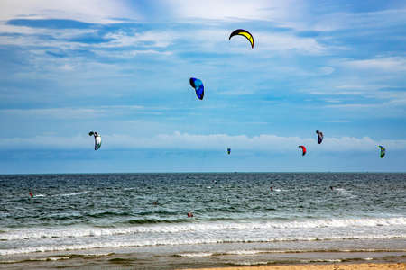ASIA, VIETNAM, MUI NE, NOVEMBER, 15, 2014 - Kitesurfers on the big waves of the South China Sea in Mui Ne, Vietnamのeditorial素材