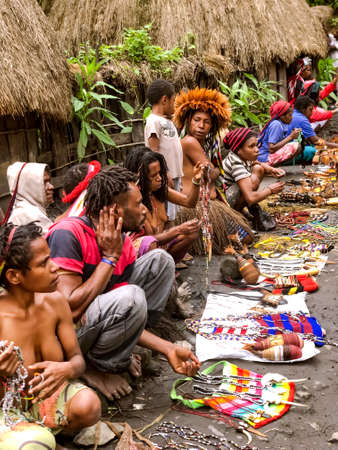INDONESIA, PAPUA NEW GUINEA, WAMENA, IRIAN JAYA, 20 AUGUST 2019: Papuans sell their handicrafts in their village in Wamena, New Guinea, Indonesia.のeditorial素材