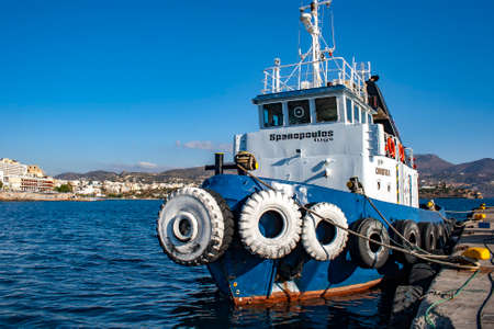 GREECE, CRETE, SEPTEMBER, 2012 - Old tugboat on the pier in the Aegean Sea on Crete, Greeceのeditorial素材