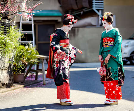 JAPAN, KYOTO, APRIL, 05, 2017 - Two nice womans in Maiko kimono dress in the old-fashioned town of Kyoto Japan.のeditorial素材