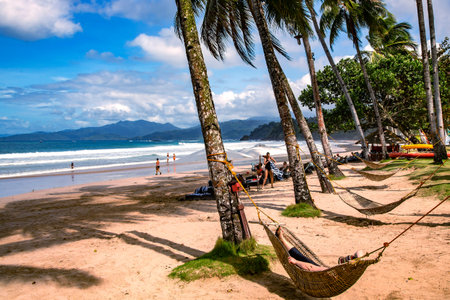 PHILIPPINES, PALAWAN, DECEMBER, 30, 2019 - Reed hammocks on the Indian Ocean beach at the Sheridan hotel on Palawan islandのeditorial素材