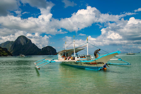 PHILIPPINES, EL NIDO, DECEMBER, 2019 - Pleasure boat in the clear waters Indian ocean near El Nido Island, Philippinesのeditorial素材