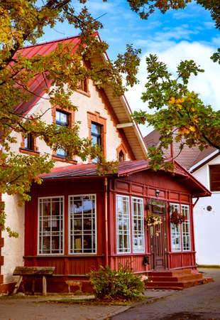 LATVIA, SIGULDA, OCTOBER, 2020 - Beautiful wooden veranda of ancient architecture near a stone house in autumn Sigulda, Latviaのeditorial素材