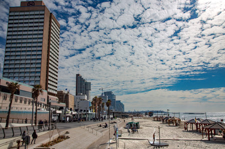 ISRAEL, TEL AVIV, FEBRUARY, 2018 - Coastline view of Tel-Aviv panoramic view of a modern downtown city on the Mediterranean sea with people restingのeditorial素材
