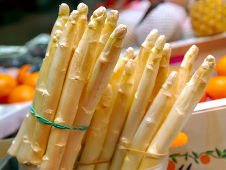 Bunch of white asparagus close up on vegetables market. Organic food concept.の写真素材