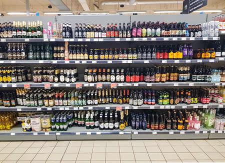 Latvia, Riga, April, 2021 - Shelves with a variety of beers from different manufacturers in the shopping mall in Riga, Latvia. Store of alcoholic drinks.のeditorial素材