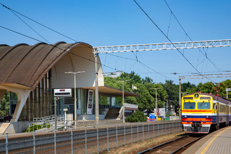 LATVIA, RIGA, JULY, 2021 - The city electric train departs from the platform at the station in...