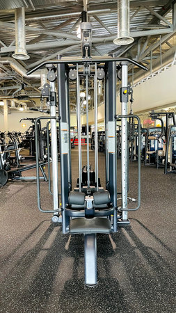 LATVIA, RIGA, AUGUST, 2021 - Machine in gym with modern fitness equipment for fitness events in...