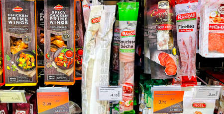 LATVIA, RIGA, AUGUST, 2021 - Traditional smoked salami and other types of meat from different manufacturers in shopping mall, Riga, capital of Latvia.のeditorial素材