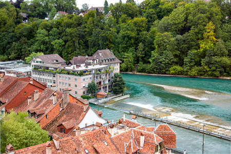 SWITZERLAND, BERN, AUGUST 2021 - Modern architecture building with landscaping of the city of Bern on the Aare river is a tributary of the High Rhine is the de facto capital of Switzerland.のeditorial素材