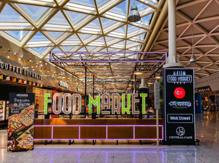 SPAIN, BARCELONA, SEPTEMBER, 2021 - Food market with varios cafes under a transparent glass ceiling in Duty Free zone at airport El Prat, Barcelona.のeditorial素材