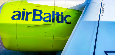 Latvia, Riga, August, 2021 - AirBaltic company logo icon on the outboard engine of the aircraft in...