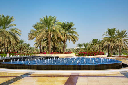 UAE, ABU DHABI, NOVEMBER, 2021 - Beautiful square with green park and fountains in Abu Dhabi,  capital of the United Arab Emirates.のeditorial素材