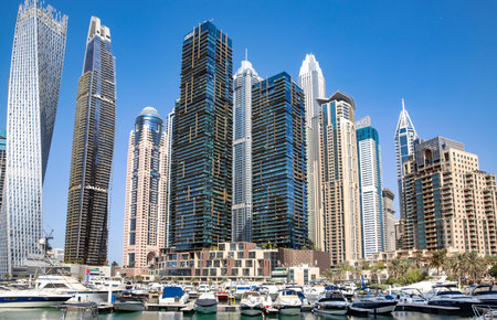 UAE, DUBAI, NOVEMBER, 2021: Dubai Marina with embankment promenade, hotels, shops and residences  at the Dubai creek harbor, Ras al Khor, Dubai, UAE.のeditorial素材