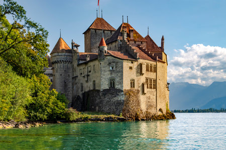 SWITZERLAND, MONTREUX, AUGUST 2021 - The Chillon Castle is landmark in Montreux on Geneva Lake against the background of the Swiss Alps at Switzerlandのeditorial素材