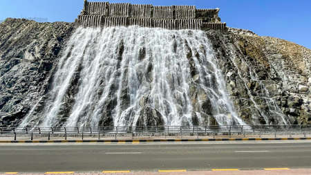 Artificial waterfall Khorfakkan with fresh water in Khowr Fakkan city, at Sharjah enclaves on the emirate of Fujairah.の写真素材