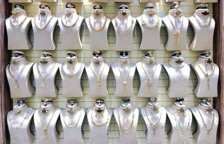 Beautiful golden jewelry on mannequins at the gold street Deira market, also called Gold souk, in the city of Dubai, United Arab Emiratesの写真素材