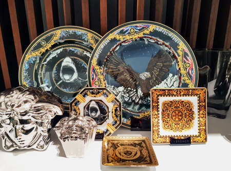 LATVIA, RIGA, FEBRUARY, 2022: New collection set of  Versace tableware with the image of animals on shelf in Riga, Latvia. Great gift concept.のeditorial素材