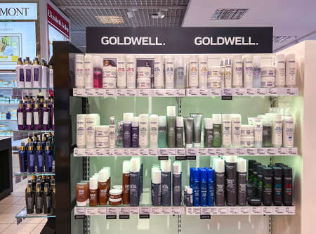 LATVIA, RIGA, MARCH, 2022 - Shelves with popular professional cosmetics Goldwell in the shopping mall in Riga, Latvia.のeditorial素材