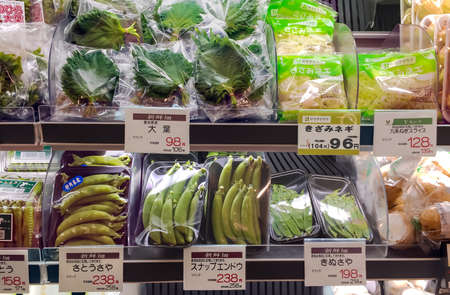 JAPAN, TOKYO, APRIL, 2017 - Fresh organic green peas, beans packed and other greens in plastic containers in supermarket shelves at Tokyo, Japanのeditorial素材