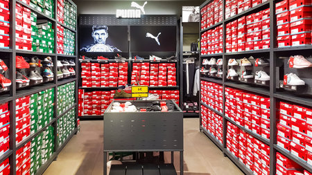 SPAIN, BARCELONA, MARCH, 2022 - Puma sneakers on the shelves in shopping centre, Barcelona. Spain....
