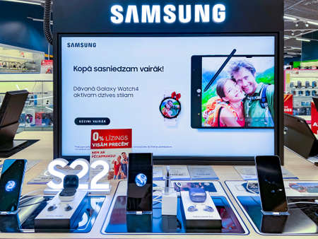 Latvia, Riga, May, 2022 - Showroom of modern electronics with new Samsung Galaxy S22 smartphone models and headphones in the shopping mall in Riga, Latviaのeditorial素材