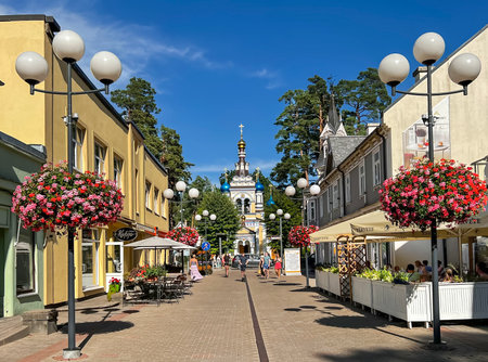 LATVIA, JURMALA, JULY, 2022 - People relaxing and enjoying outdoor cafe at the Jomas street in the center of Maiori in Jurmala, Latviaのeditorial素材