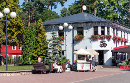LATVIA, JURMALA, AUGUST, 2022 - Cafe with open veranda on Jomas street in Majori, Jurmala, Latvia. Jurmala is seaside resort town stretching 32 km on coast of Gulf of Riga of Baltiのeditorial素材