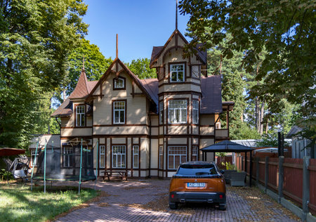 LATVIA, JURMALA, AUGUST, 2022 - Exterior view ancient renovation wooden home with turrets in Jurmala, Latvia. Traditional Jurmala architecture.のeditorial素材