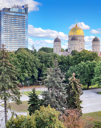 LATVIA, RIGA, AUGUST, 2022: Panoramic view of Modern multi-storey building of the Radisson Blu hotel and Orthodox cathedral in Riga, capital of Latvia. EU.のeditorial素材