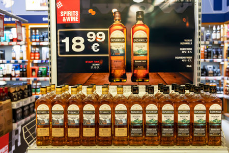 LATVIA, RIGA, SEPTEMBER, 2022: Bushmills irish whiskey with special offers on a promotional trading pallet in supermarket in Riga, Latvia.のeditorial素材
