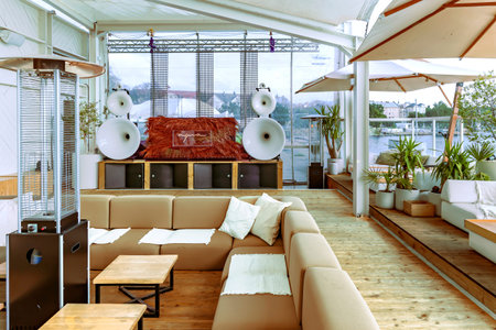 LATVIA, RIGA, AUGUST, 2022: Stylish modern interior Aqua Luna restaurant with a roofed sail in the...